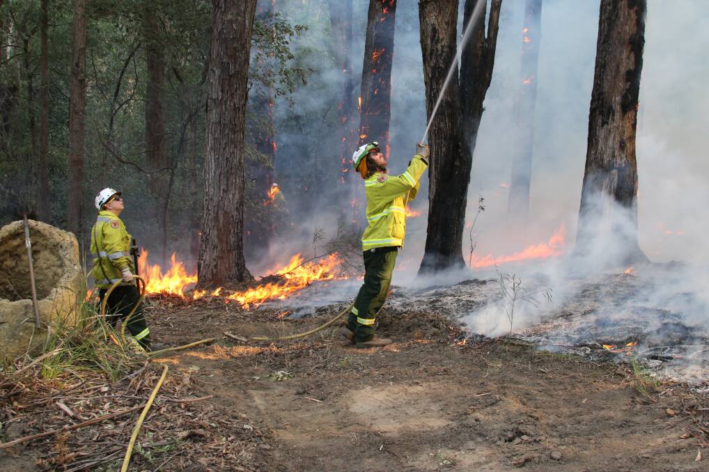 National Parks and Wildlife Services firefighers working to control the Mt Kingiman fire on the South Coast in August 2018. Photo: NSW Office of Environment and Heritage. 