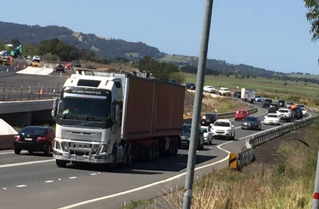 Heavy traffic has built along the Princes Highway and some cars are moving at a snail's pace. 