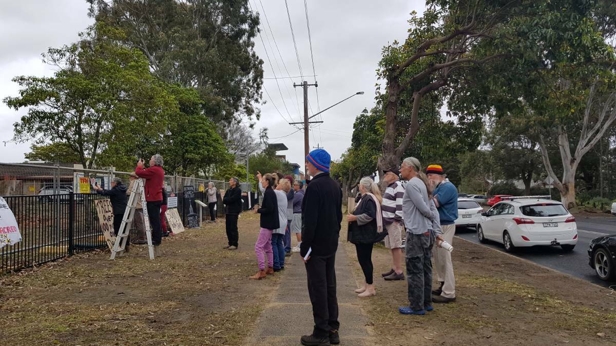 Protesters gather over the removal of trees at the Huskisson Anglican Church.