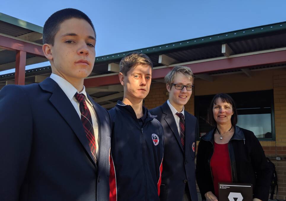 RESPECT: Year 9 students Archie Collison, Baxter Scully, Max Legzdin who are entering a video in the Say it in Pictures competition with Nowra Anglican College principal Lorrae Sampson.