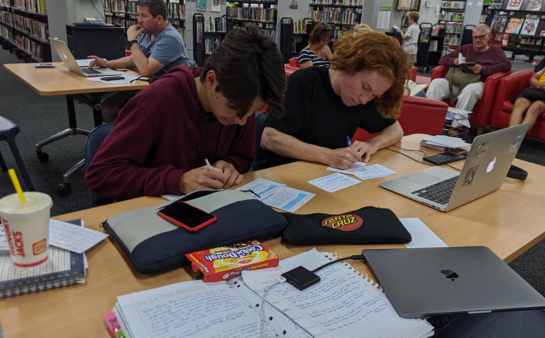 St John's the Evangelist students Colin Vu and Noah Lewis studying for their English HSC exam in the Nowra Library.