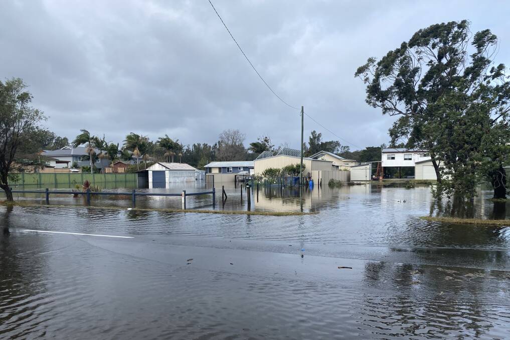 Flooded houses in Sussex Inlet on Tuesday. Photo: Stuart Thomson. 