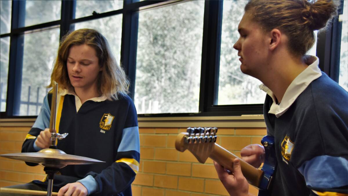 PRATICE: Debbies practising together in one of their school's music rooms. 
