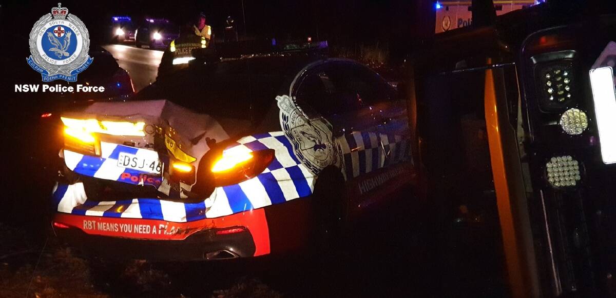 CRASH SCENE: Two NSW Police officers injured injured and taken to hospital after the vehicle they were in was struck by a 4WD. Photo: NSW POLICE