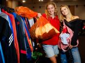 Ayla Vaessen and Mia Paton with bags of clothing they purchased at the Vintage Kilo Sale at UOW on Saturday, April 27, 2024. Picture by Anna Warr