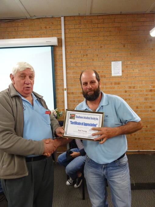 Ray Fauld presents a certificate of appreciation to Rod Young.
