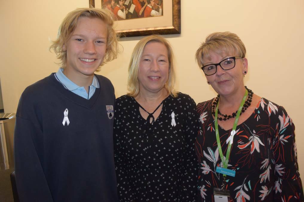 Nowra Christian School student Micah Perry, Michelle Perry and Council's Donna Corbyn at last year's White Ribbon event. Nowra Christian School received two awards for its videos.

