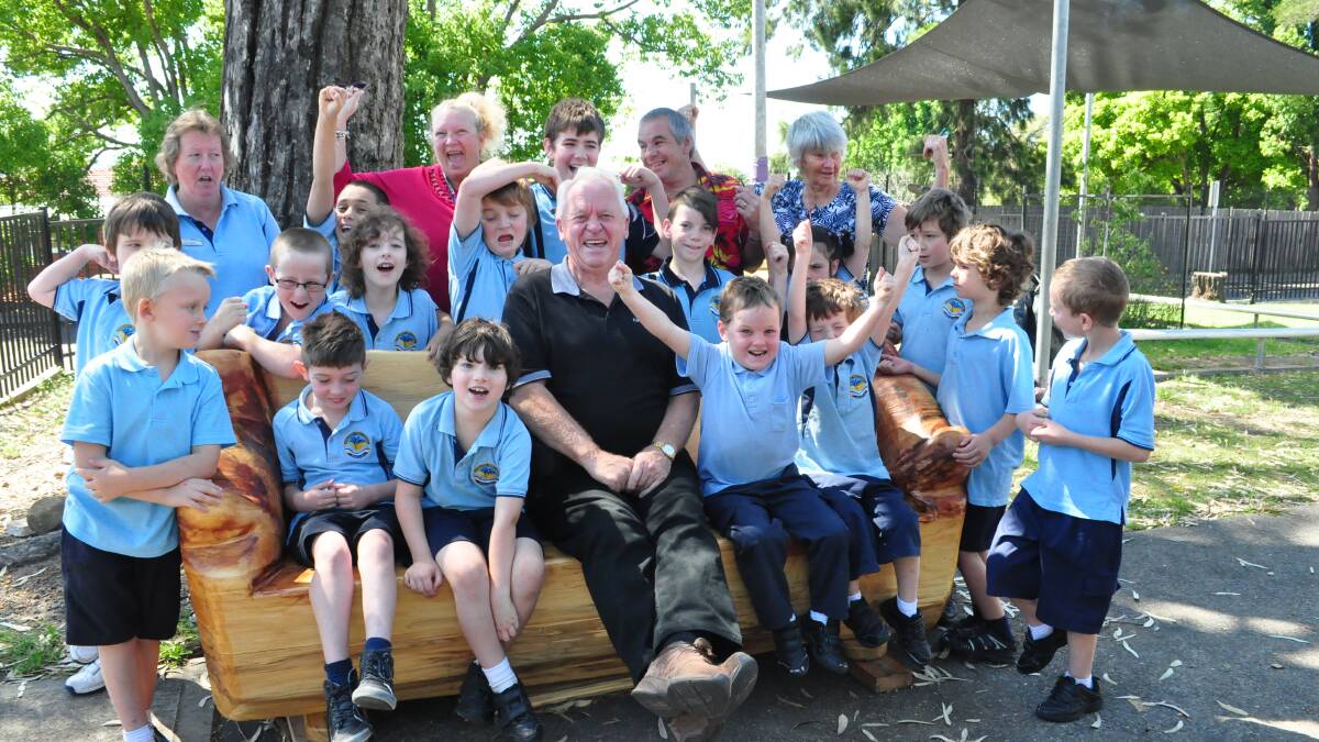 SO GOOD: Bob Aulsebrook now has a new group of friends following his recent donation of a wonderful wooden bench to Bomaderry Public School.
