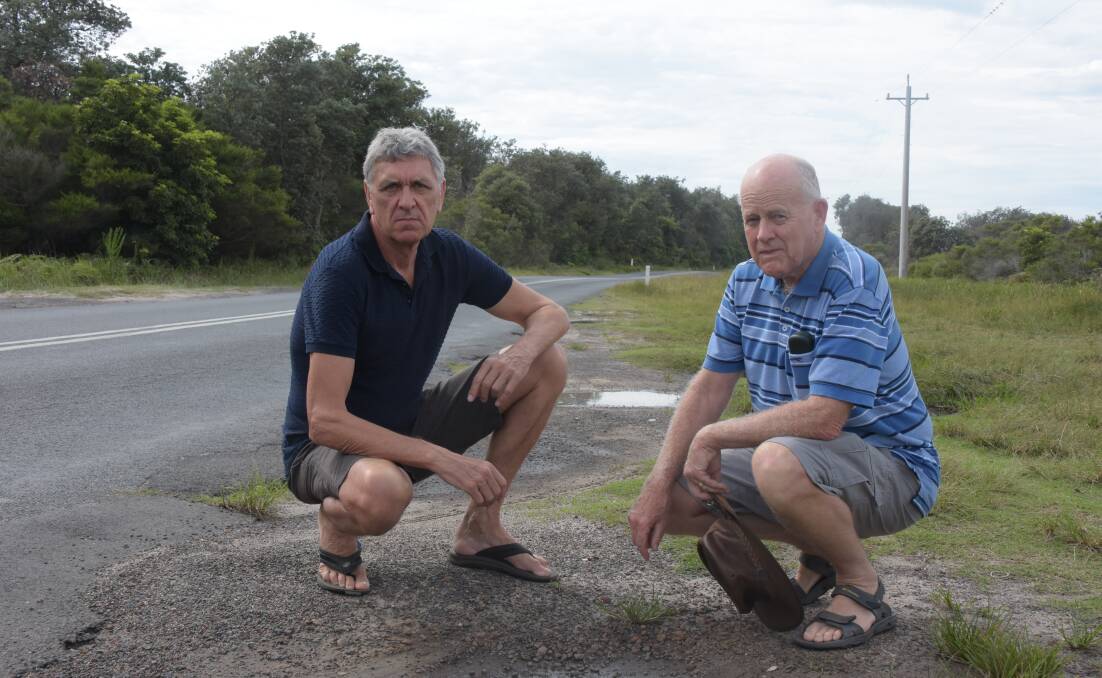 An unhappy Tony Lund and Les Lawrenson near the dangerous Currarong Road.