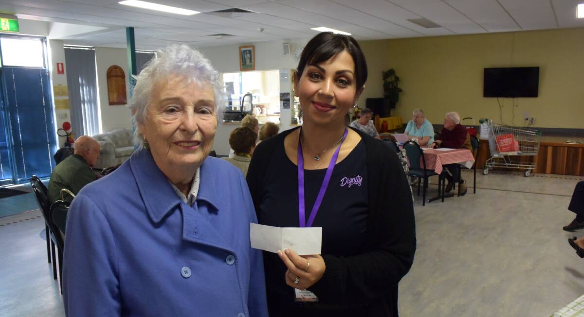 Volunteer Jenny Dickerson and Dignity's Volunteer and Donation coordinator Sherin Fishwick thank the Shoalhaven Senior Citizens group for their support.
