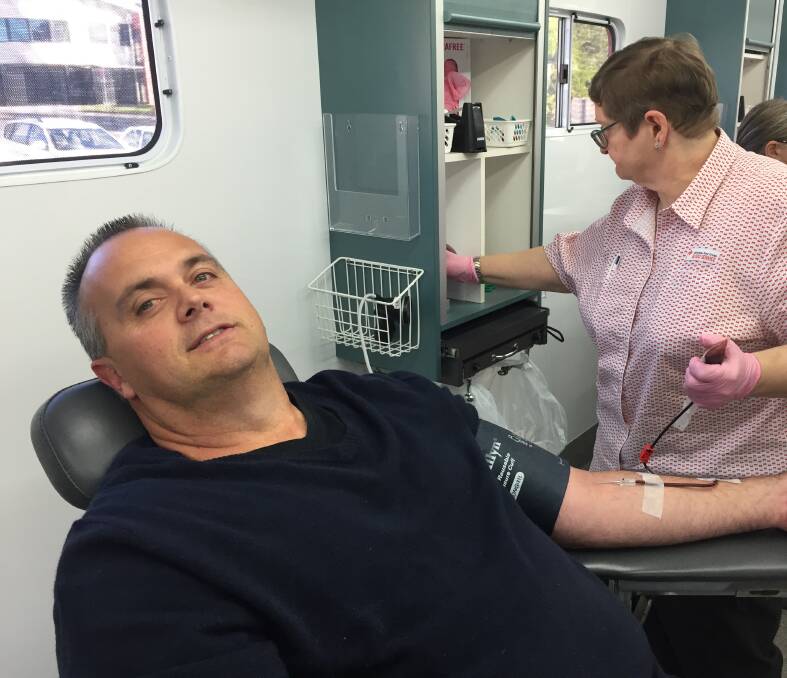 HELPING OTHERS: John Dun donates blood. John is nearing his ninth donation after being inspired to start the journey after nearly losing his son just over two years ago. 