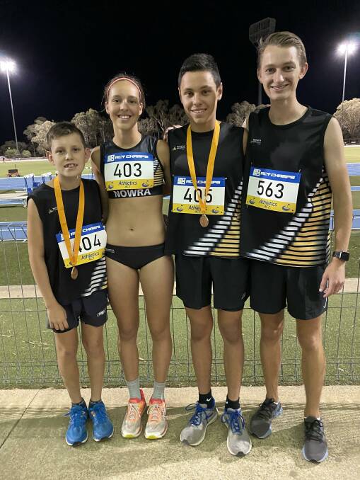 WELL RUN: Nowra Athletics Club athletes Toby, Ella and Will Dyball with Cam Musgrove pictured at the recent AACT Championships in Canberra.