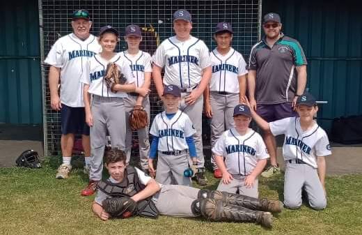 Mariners Junior League players and coach.