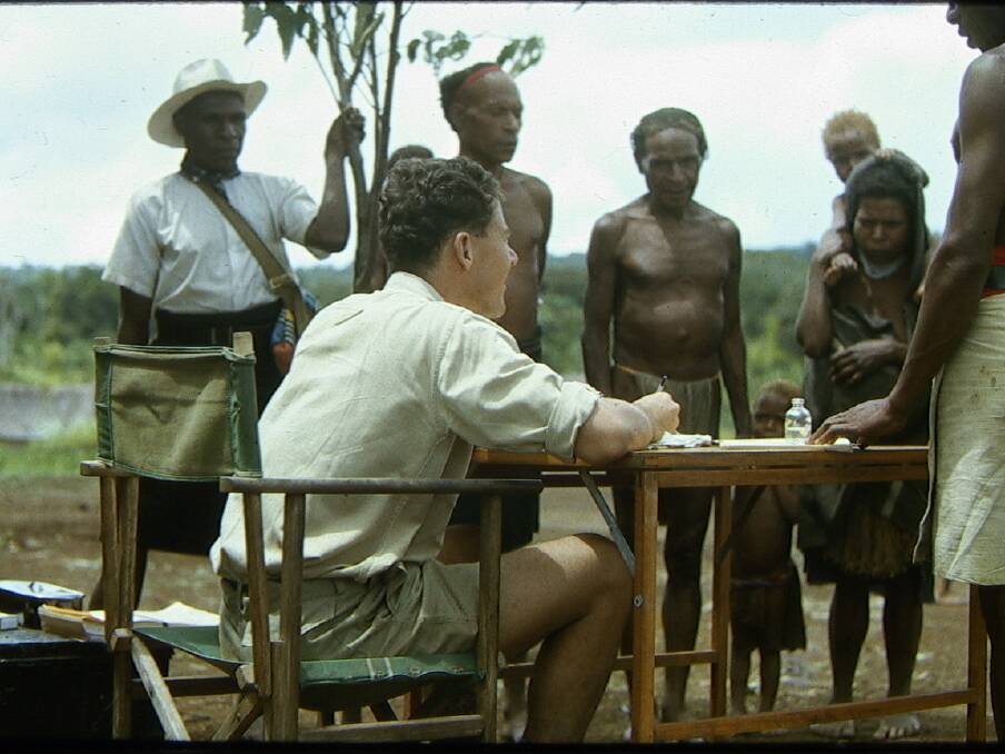 A field trial of a vaccine against leprosy in 1965. Prof Riley is behind the desk. 