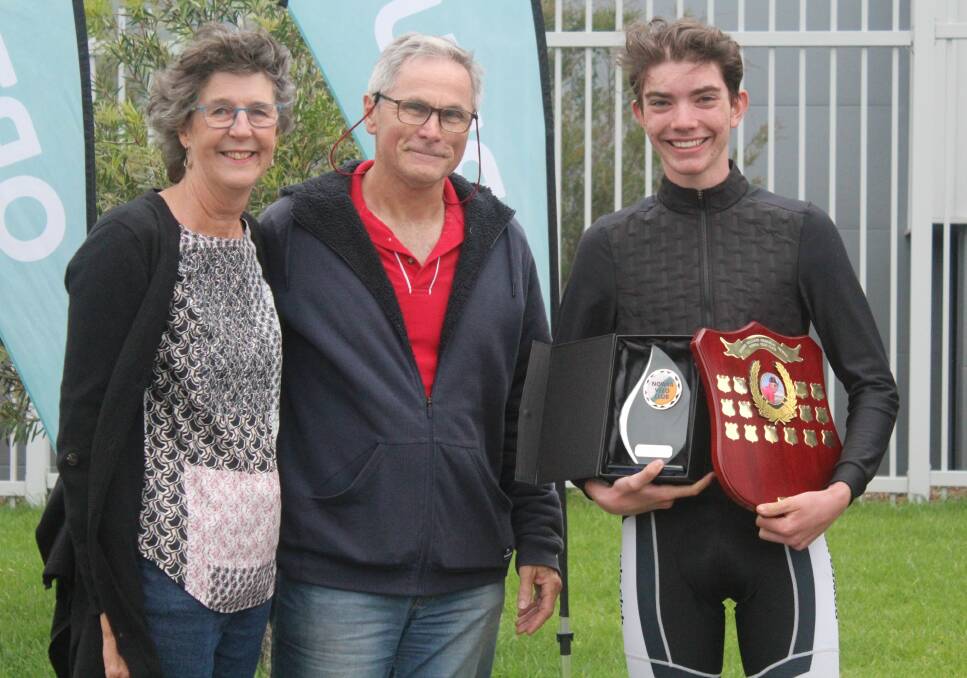 Curtis being presented with the memorial awards by Robbie's parents, Sue and Bruce Williams.