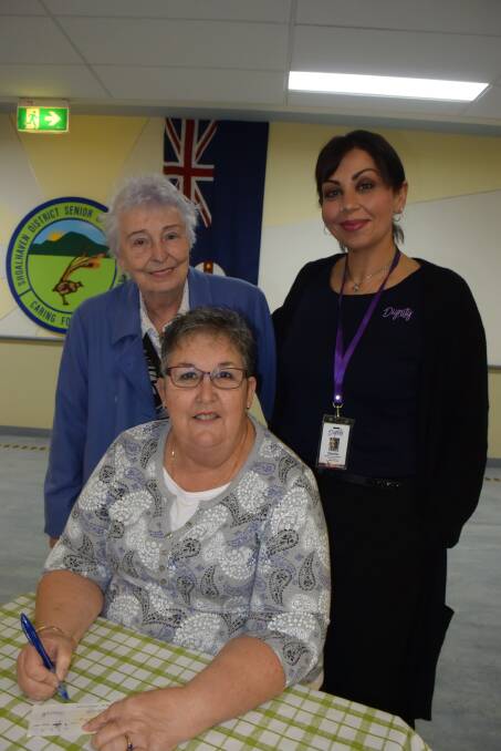ALL HELPS:  Volunteer Jenny Dickerson and Dignity's Volunteer and Donation coordinator Sherin Fishwick with president of the Shoalhaven Senior Citizens Cheryl Wright.