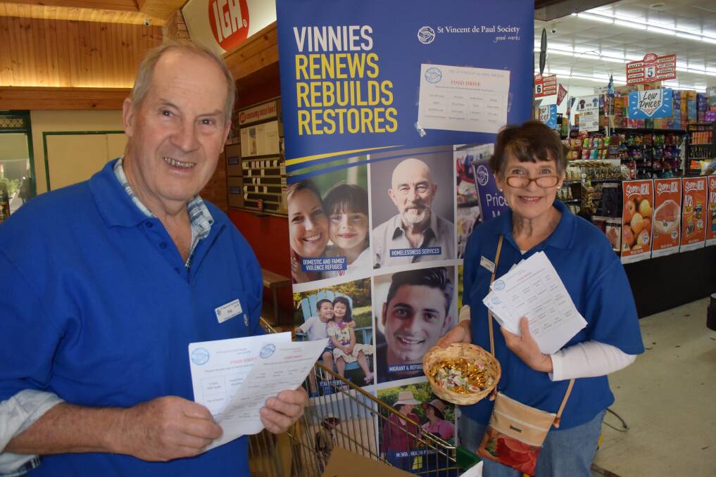GREAT EFFORT: Phil  and Wendy Reid want to thank everyone for supporting St Vincent de Paul Society's food drive on Friday. 