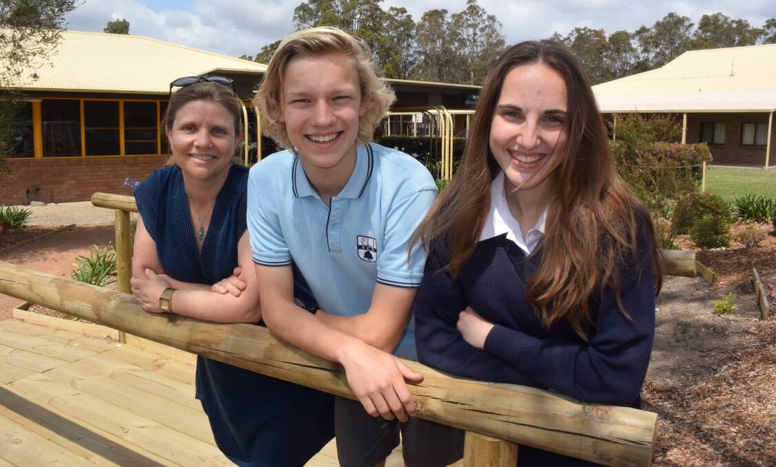 Teacher Rosie Ellery with students Micah Perry and Charlotte Dickinson who received an award from the Nowra Domestic Violence Committee for their anti-domestic violence video. 