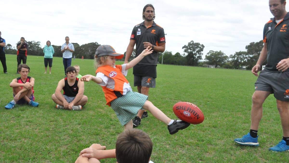 Star players at footy clinic 