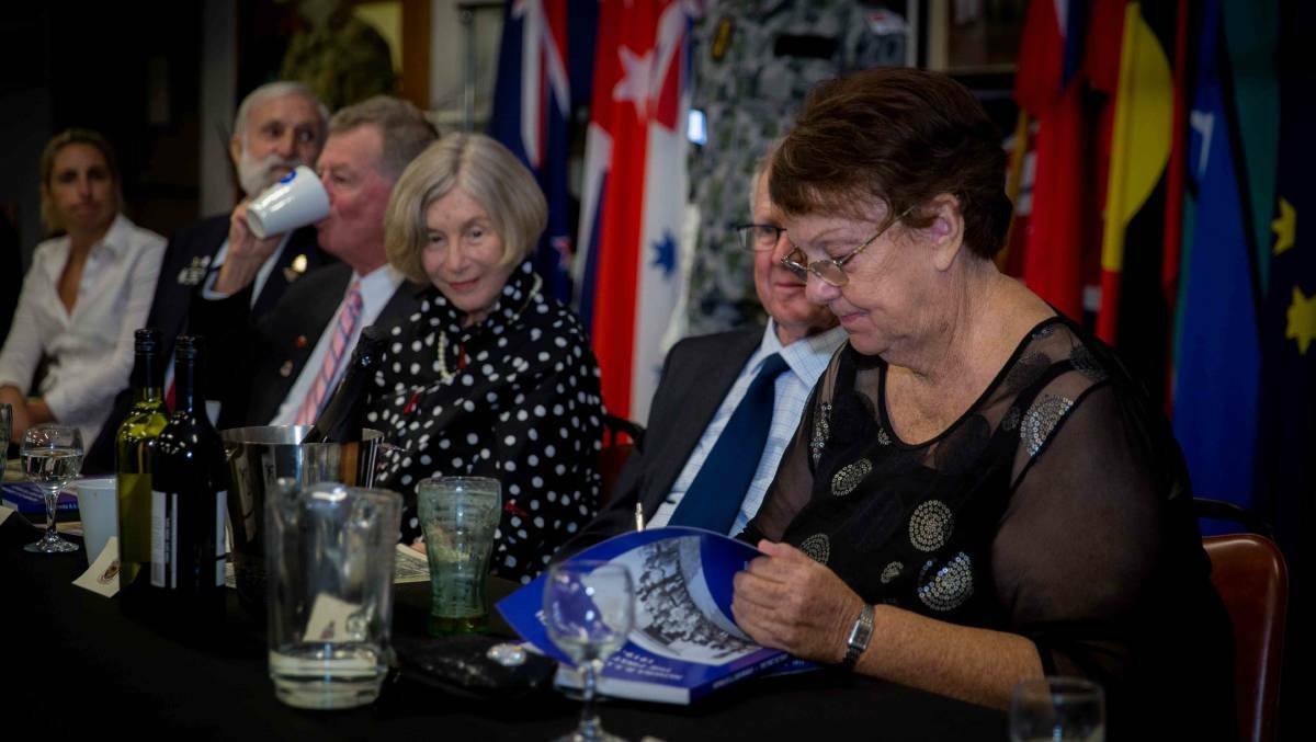 Robyn Florance signs a copy of 'Nowra RSL Sub Branch the First 50 years 1919-1969'. Photo: Anthony Stone Photography 