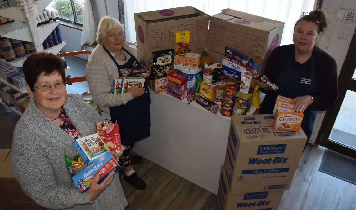 Food store coordinator, Helen Esdaile with volunteers Loraine and Christine.