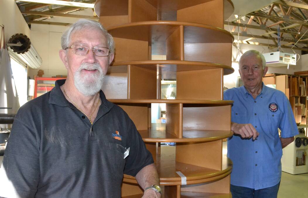 BUILD IT BOYS: Shoe rack built by Bob Matheson (left) with Ted Jarrett at the Berry Men's Shed.