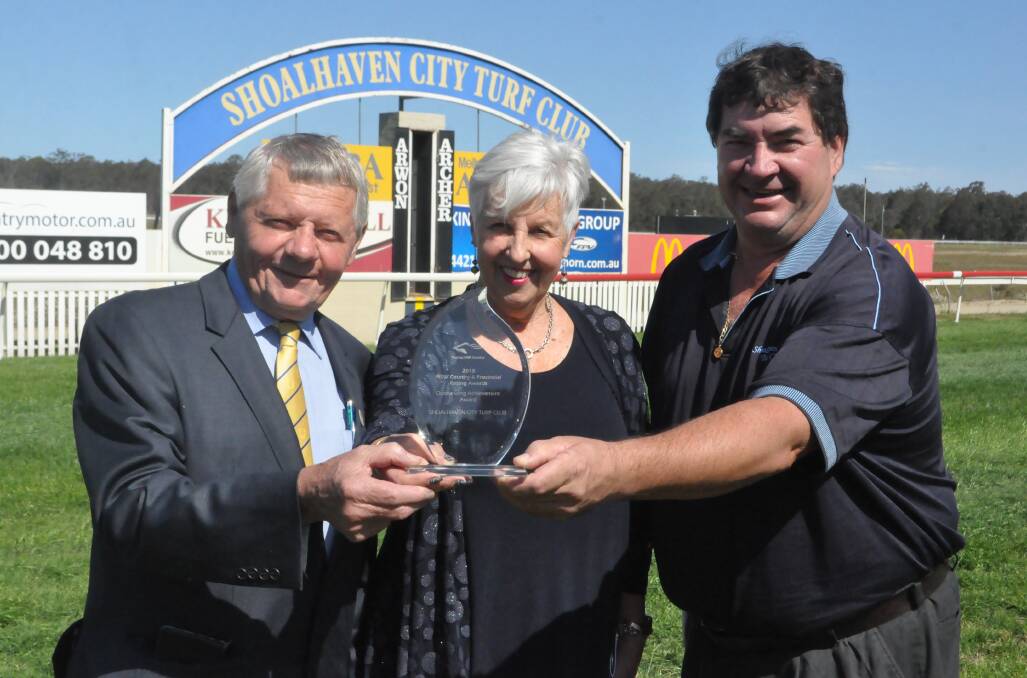 Ian Whitby (Vice President), Lynn Locke (Chief Executive Officer) and Michael Martin (Chairman) from the Shoalhaven City Turf Club show off the achievement award.