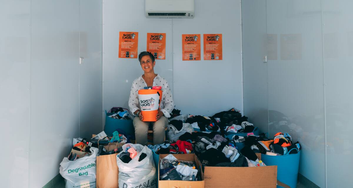 Grace Rey with some of the donated socks and jocks.