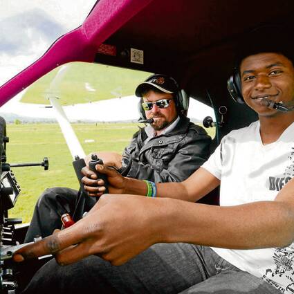 AERIAL FINESSE: South Coast Recreational Flying Club chief flying instructor Andrew Campbell teaches Solomon Tesfaye the finer points of becoming a pilot.