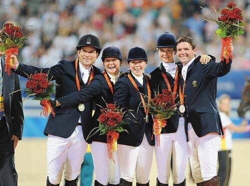 OLYMPIC ROSE: Australia’s Shane Rose (left), Megan Jones, Sonja Johnson, Lucinda Fredericks and Clayton Fredericks pose with their silver medals on the podium of the Beijing Olympic Games Team Eventing Equestrian competition in Hong Kong.