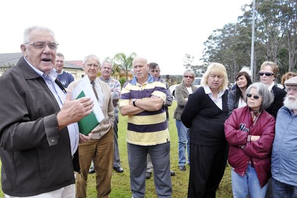 TO THE POINT: Golden Grove resident Don Mackaness speaks to a gathering in the street on Thursday as people came together for the latest phase in a mediation process over a controversial community housing proposal.