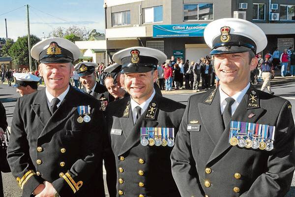 SPECIAL EVENT: New recruits to the Royal Australian Navy, Lieutenant Steve Cole and Chief Petty Officers Peter Cassar and Rob Strutt ready themselves for their first Anzac Day march.
