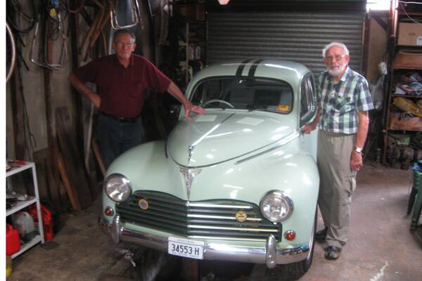 BACK TO THE FUTURE: (Left) Albert’s brothers Keith and Robert Bridge with Albert’s Bathurst racer which Keith restored over a period of five years.