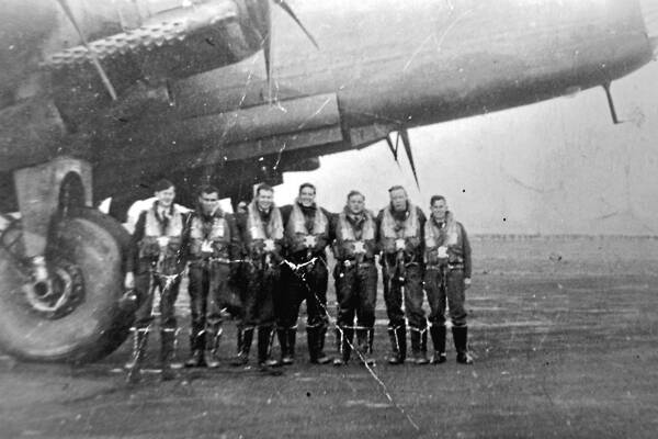 TEAMWORK: George Lamond, left, with the crew of the Halifax bomber he flew in World War II. Photo: LEA HAWKINS