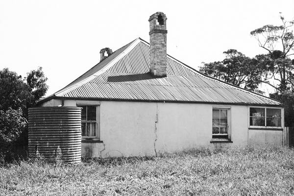 FORMER GLORY: Comberton Grange homestead before it was burnt down in 1989. Its convict made bricks were sold at a council auction despite the ruin being heritage listed. 