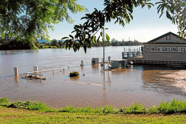 WATER WORLD: (above) While the Shoalhaven River rose above the boat ramp last week, in 1974, Nowra Sailing Club was almost submerged. (Below)
