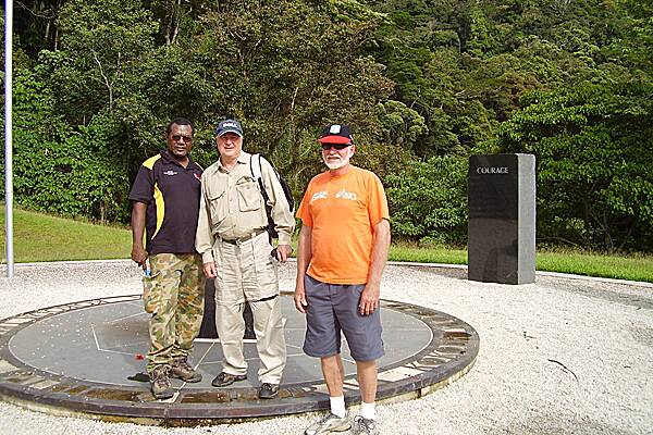 PROJECT UNDER WAY: Russell Eroro, Milton Lay and Len Thompson. Mr Lay and Mr Thompson met with Mr Eroro and other village Elders to discuss the community hall project. This photo was taken at the Isurava Memorial on the Kokoda Track in 2008.