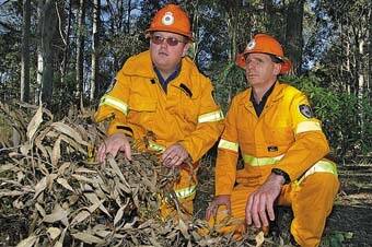 EARLY WARNING: Deputy Rural Fire Service control officers Tim Carroll and Steve McKinnon examine some vegetation that could cause a bushfire