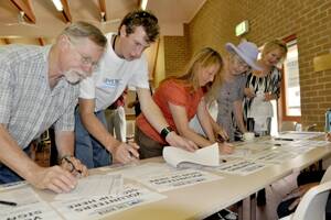 DOTTED LINE:  Signing up to volunteer for the Love the River campaign are Terry Barratt, Damon Barclay, Marianne Jones, Patrician Mason and Deborah Eli.