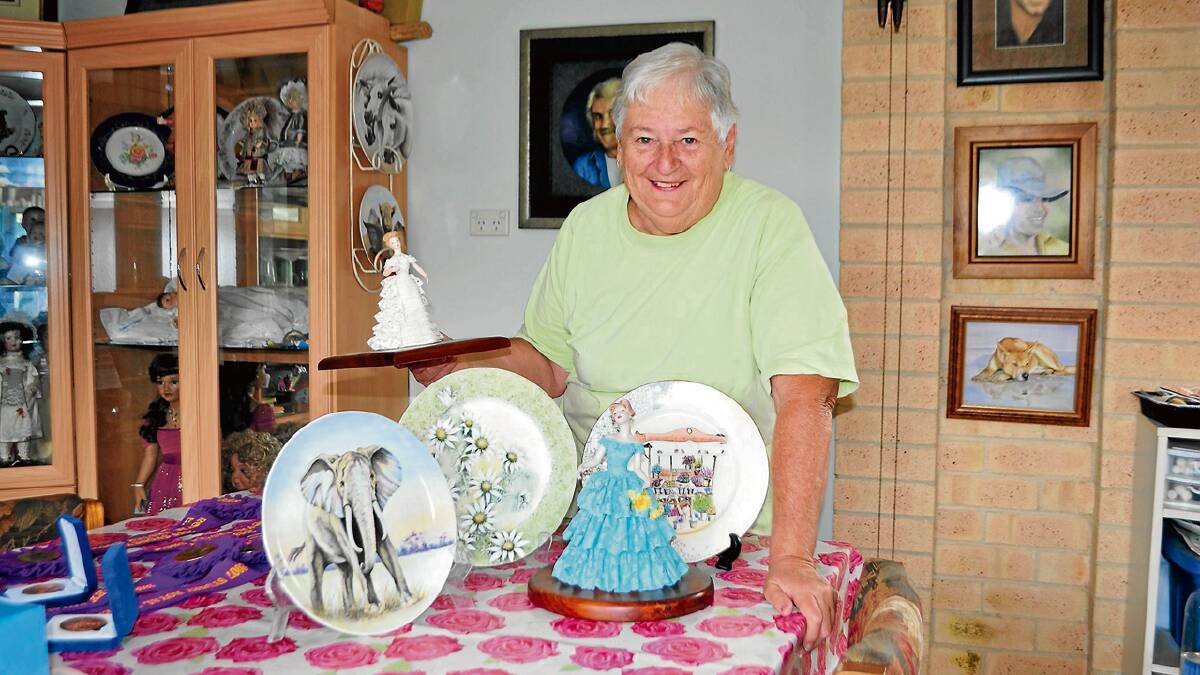 CHINA CHAMPION: Cambewarra porcelain artist Faye Suffolk with some of her award winning works.