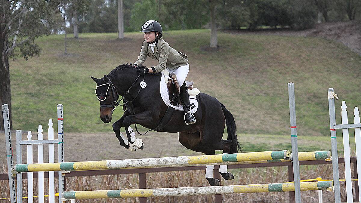 HORSE TALK: Cambewarra local Jamie Priestley has forged her name as a show jumping champion.