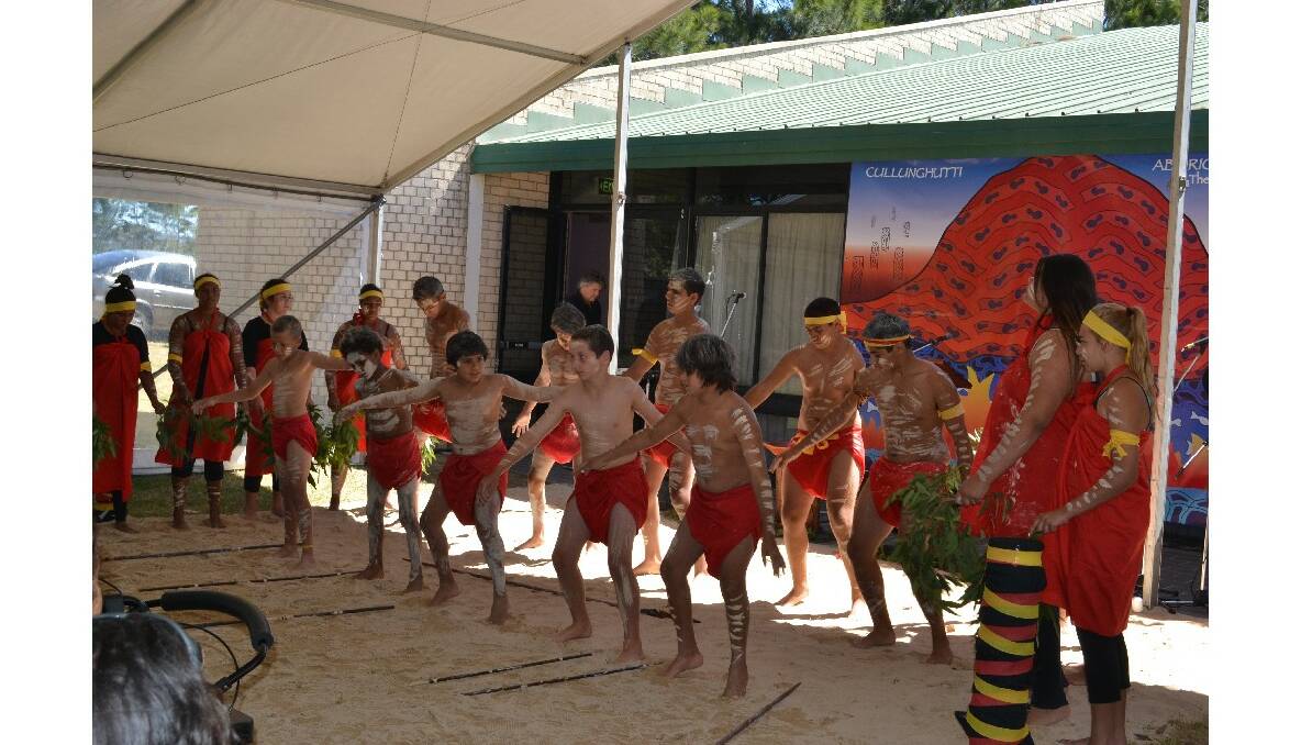 Students from Bomaderry High School and East Nowra Public School perform the welcome dance at the Cullunghutti Aboriginal Area community celebration at the Shoalhaven Heads Community Centre on Friday.