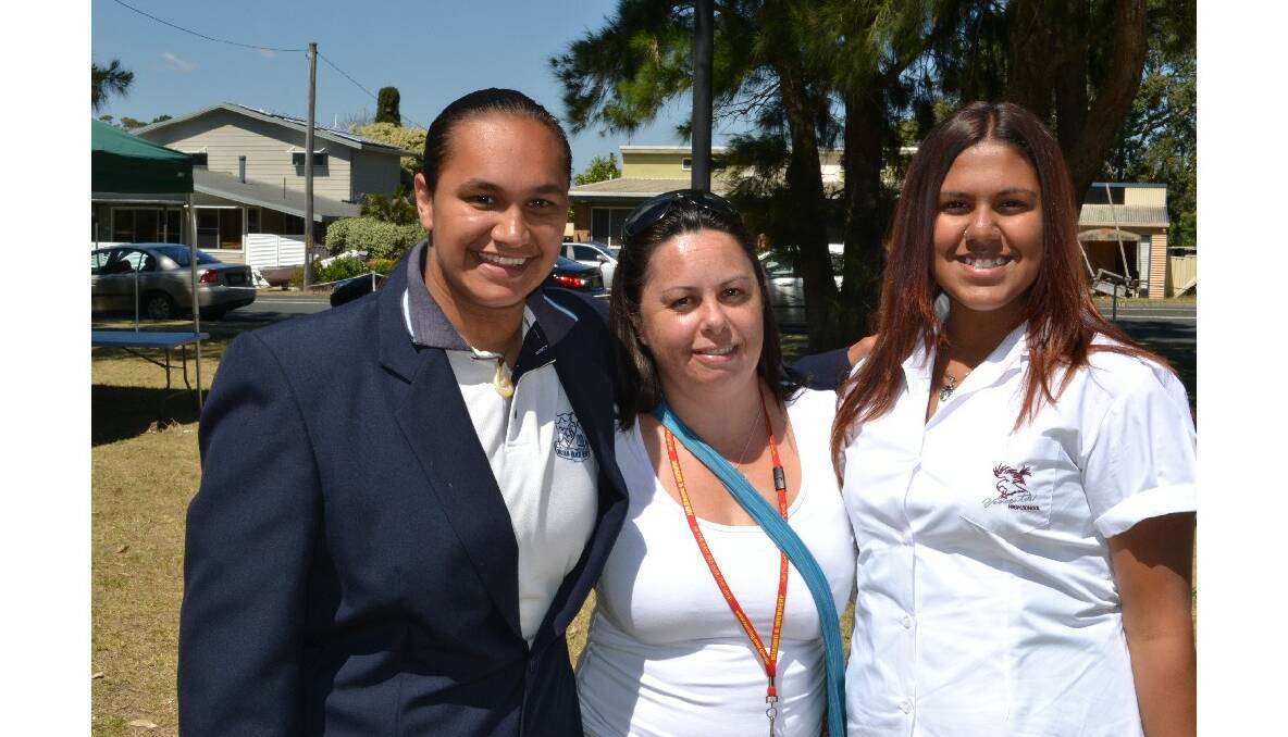 Jenayha Helmons from Worrigee and Nowra High representative, Sharon Webster from Nowra High School and Shakeeh Williams from Nowra representing Vincentia High School celebrate the historical moment at the Cullunghutti Aboriginal Area community celebration at the Shoalhaven Heads Community Centre on Friday.