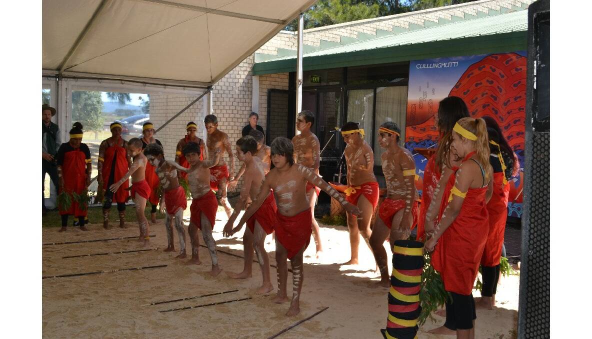 Students from Bomaderry High School and East Nowra Public School perform the welcome dance at the Cullunghutti Aboriginal Area community celebration at the Shoalhaven Heads Community Centre on Friday.