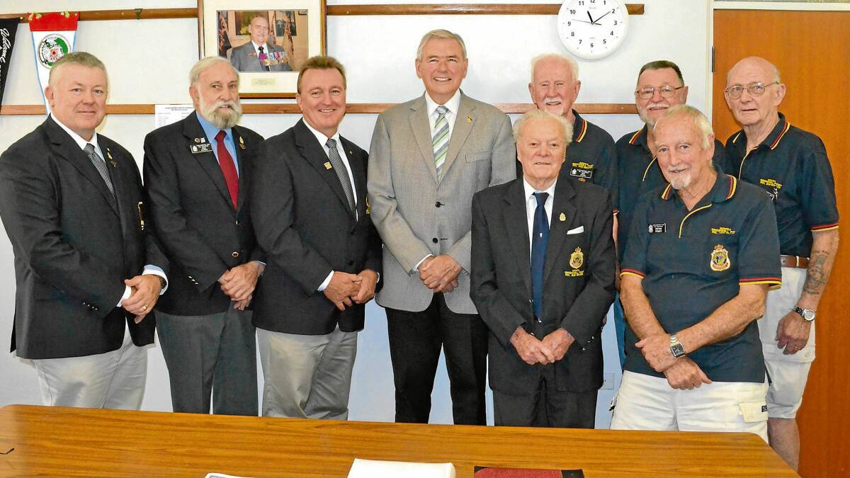 HONOURED GUEST: National president of the RSL, Rear Admiral Ken Doolan (second from left) looks over the design of the 2015 Digger Day jumper with (from left) Nowra-Greenwell Point RSL Sub-Branch vice-president Fred Campbell, secretary Rick Meehan and president Fred Dawson.