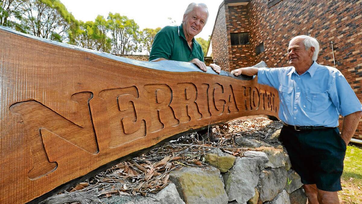 SIGNING OFF: Bob Aulsebrook and David Smith with the recently finished sign which will hang in the Nerriga Hotel.