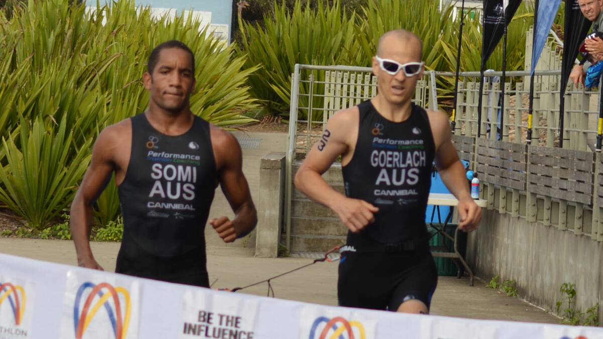 ACROSS THE LINE: Nowra’s Jonathan Goerlach (right) crosses the finish line at the Australian and Oceania Paratriathlon Championships with guide Daudi Somi.