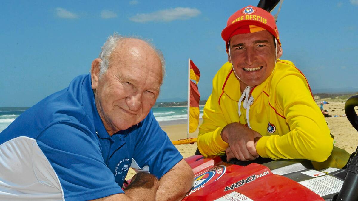 RESPECTED: Lifesaving legend Reg Wood and his grandson Brad Wheeler mark a milestone at the Sussex Inlet Surf Life Saving Club. 