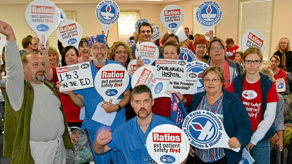 BETTER CARE: NSW Nurses and Midwives Association regional organiser Mark Murphy (centre front row) with Shoalhaven based nurses at Wednesday’s rally at the Bomaderry Bowling Club.
