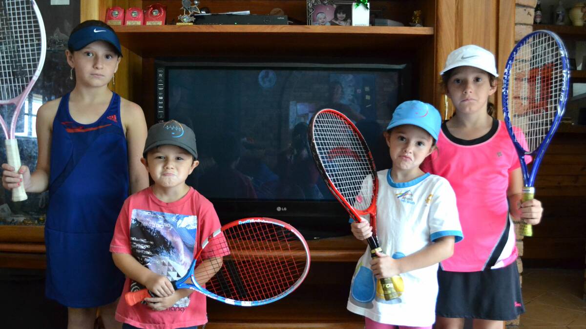 FAULT: Tennis fans Emily (10), Aiden (4), Chloe (6) and Jasmine (7) Beetson from Bomaderry can’t think of anything worse than missing the Australian Open on television.
